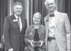 Pictured from left are THC Commissioner Pete Peterson, Geri Burnett, and THC Executive Director Mark Wolfe. Article Image Alt Text
