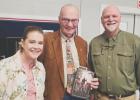Award-winning author Tom Goodman (right) presents his latest book, “The Last Man”, to Rotary member Donald Pylant. Pictured with Elizabeth Williams, President of Rotary Club of Cameron. Photos Courtesy of Chuck Dart