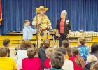 Randy Billingsley demonstrates the use of a long rifle.