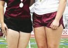 LEFT: Riley Shock wins the silver medal and Bethany Preusse the gold medal in the discus competition at Regionals to advance to state on May 15 in Austin.