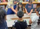 Local artist Pamela Neeley introduced the children to the art of pottery at the library last week. Photo courtesy of Cameron Library