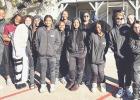 Members of the Lady Yoe basketball team volunteer with the Feed My Sheep ministry in Temple, helping prepare and serve meals, distribute warm clothing, and organize donations during a day of service. Courtesy Photos