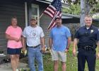 Citizen Tammy Pickett, Volunteer installer Duane Kuhl, Thorndale Lumber Company Manager Dustin Geter and Police Chief Scott Roberson.