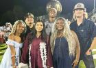 Graduate Lorena Cobio takes a photo with her siblings Erica, Erin, Leo, Eric, and Jacob. Photo Submitted by Daisy Salinas