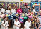 Members of the Stitches of Love and Hope Quilting Program at the Hobby Unit in Marlin pose with (and pray over) quilts and pillowcases they made to donate to local foster care systems. Photos courtesy of TDCJ Facebook Members of the Stitches of Love and Hope Quilting Program at the Hobby Unit in Marlin pose with (and pray over) quilts and pillowcases they made to donate to local foster care systems. Photos courtesy of TDCJ Facebook