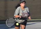 Cameron Yoe’s Delilah Warner gets ready to return the ball against her opponent last week, in the team’s district match with Academy. Cameron Yoe’s Delilah Warner gets ready to return the ball against her opponent last week, in the team’s district match with Academy.
